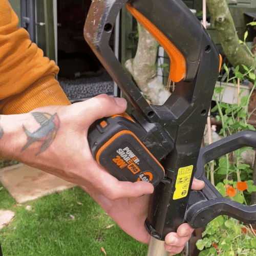 worx battery being replaced on a worx cordless strimmer