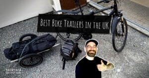 Gardener with bike and Klarfit cargo bike trailer loaded with gear, promoting best bike trailers in the UK